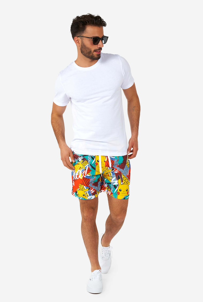 Man wearing colorful summer shorts and shirt with Pikachu Pokemon print