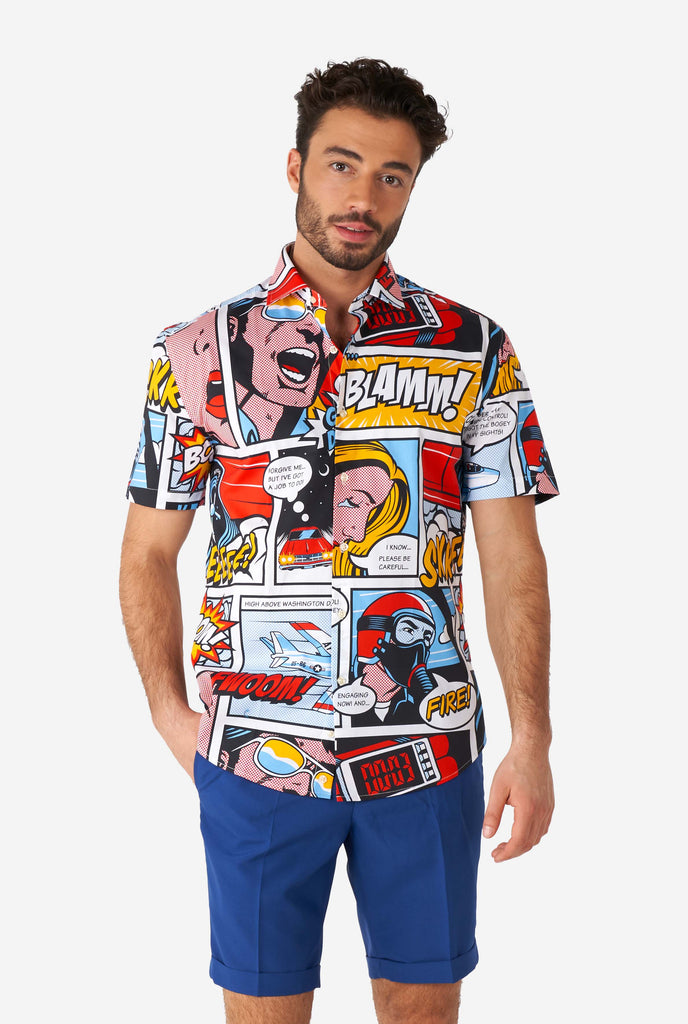 Man wearing summer shirt with Comic book print and blue shorts