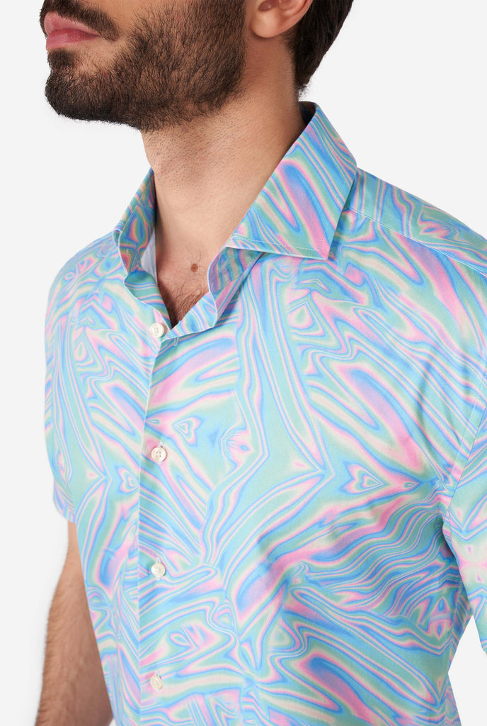 Man wearing short sleeve shirt with colorful oily print, close up