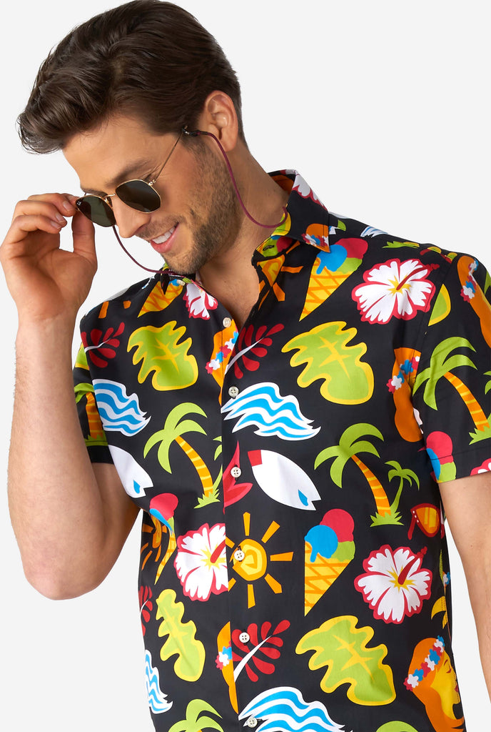 Man wearing black summer shirt with tropical icons. close up