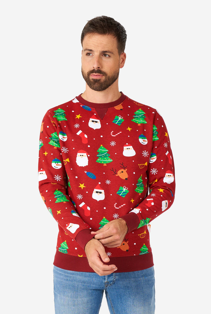 Man wearing red Christmas sweater with Christmas icons