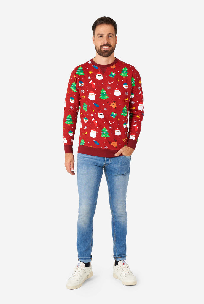 Man wearing red Christmas sweater with Christmas icons