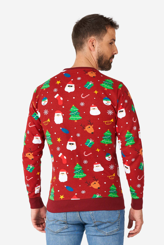 Man wearing red Christmas sweater with Christmas icons, view from the back