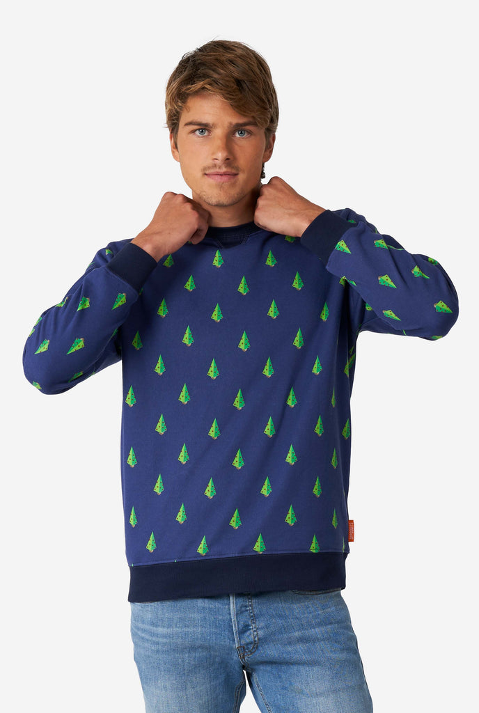 Man wearing blue Christmas sweater with Christmas tree print