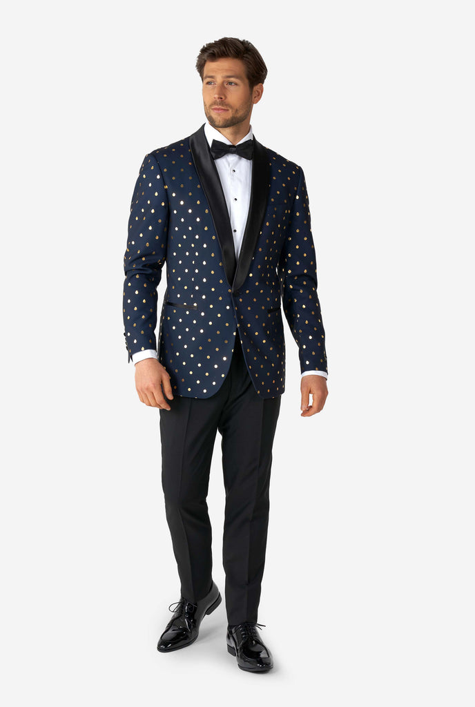 Man wearing blue tuxedo with golden dots