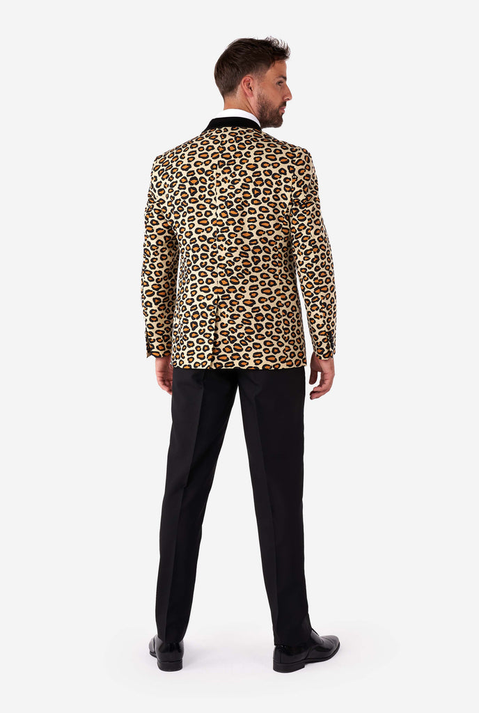 Man wearing tuxedo with jaguar print jacket