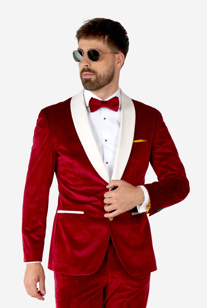 Man wearing red and white santa Christmas tuxedo