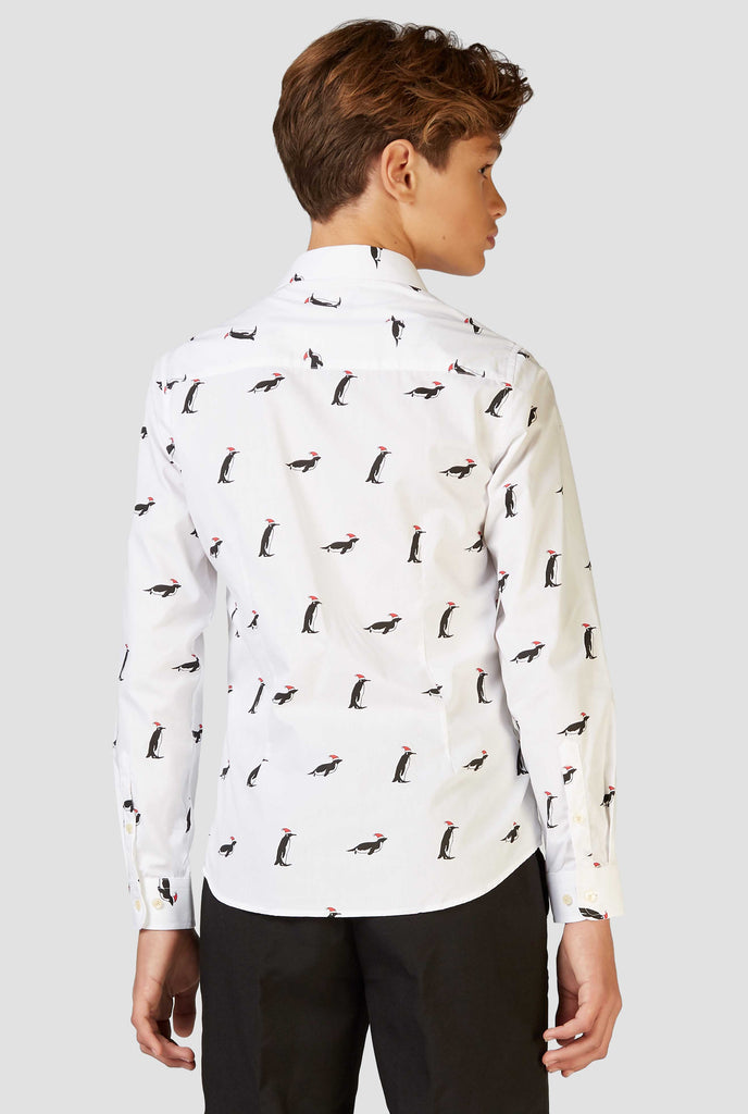 White Christmas dress shirt with Christmas penguins worn by a teen boy shown from back