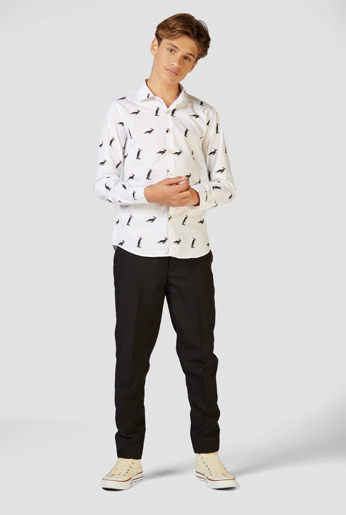 White Christmas dress shirt with Christmas penguins worn by a teen boy