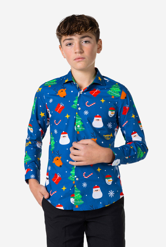 Teen wearing blue dress shirt with Christmas print