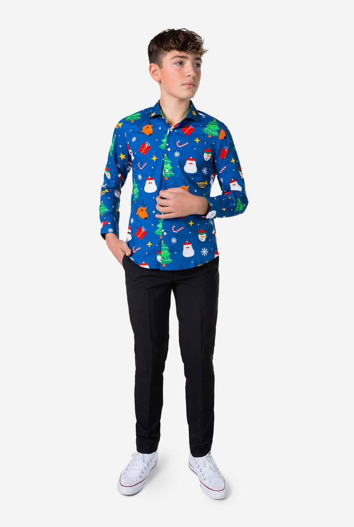 Teen wearing blue dress shirt with Christmas print