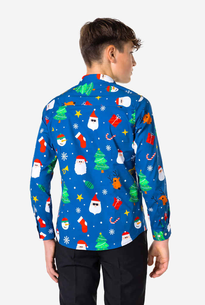 Teen wearing blue dress shirt with Christmas print, view from the back