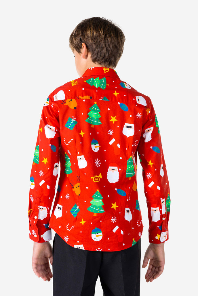 Teen wearing red dress shirt with Christmas print, view from the back