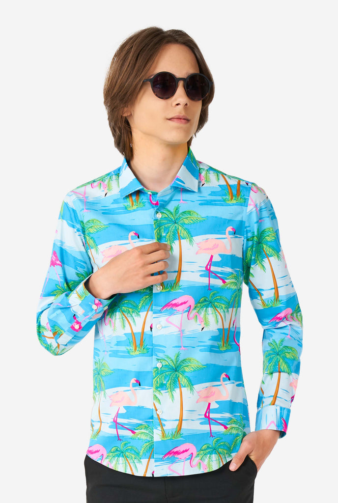 Teen wearing Hawaiian dress shirt with tropical flamingo shirt