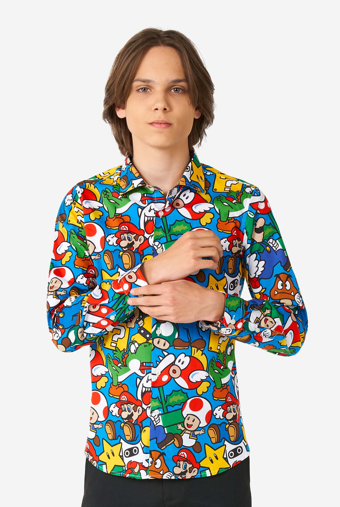 Teen wearing dress shirt with Super Mario print