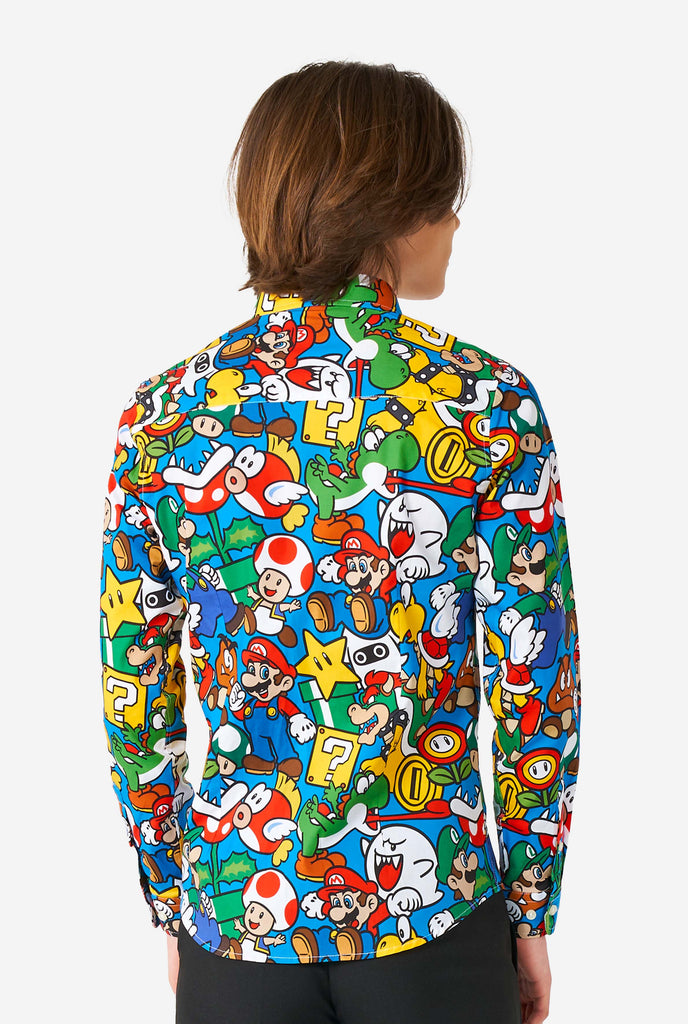 Teen wearing dress shirt with Super Mario print, view from the back