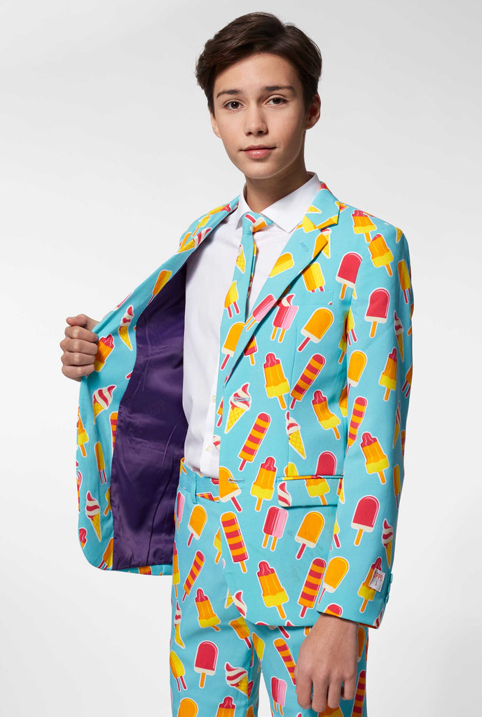 Teen wearing light blue formal suit with popsicle print