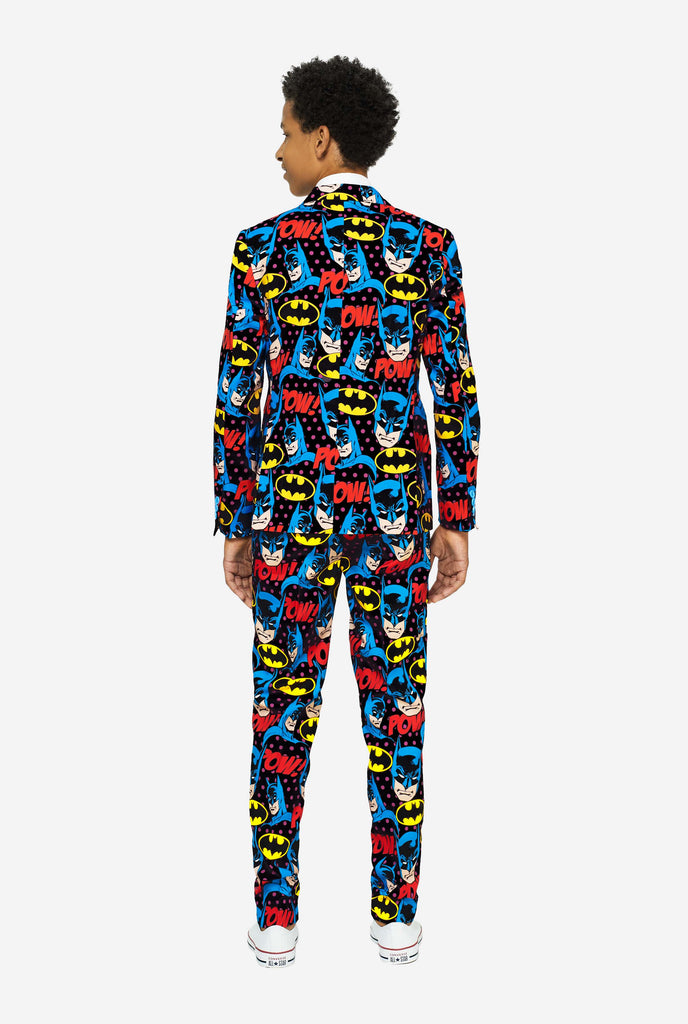 Teen wearing form suit with Batman print