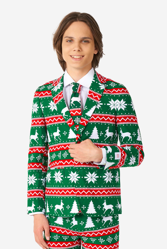 Teen wearing green formal Christmas suit