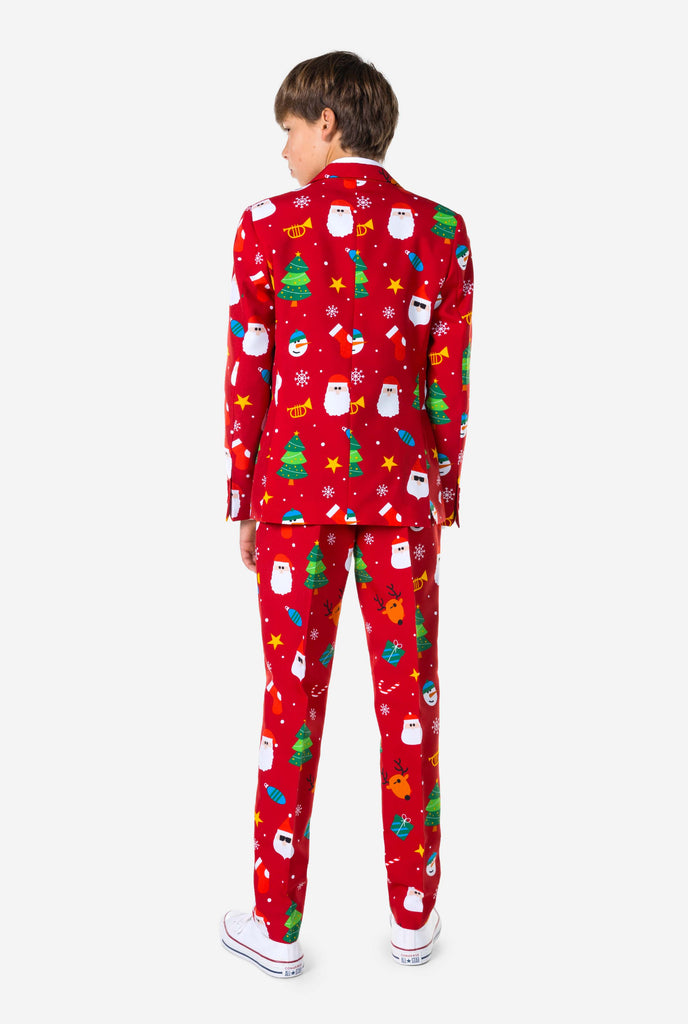 Teen wearing formal red Christmas suit, view from the back