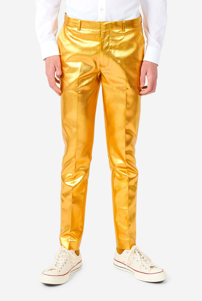 Teen wearing formal golden colored suit, zoomed in at pants