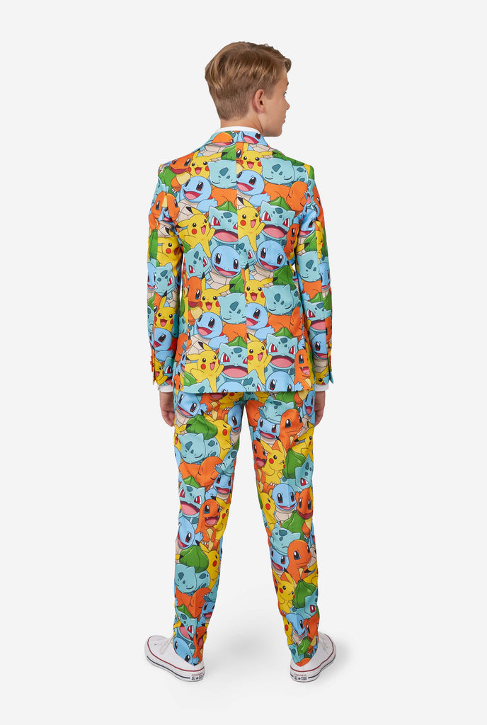 Teen wearing formal multi color suits with Pokemon print, view from the back