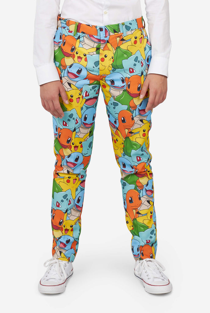 Teen wearing formal multi color suits with Pokemon print, close up of pants