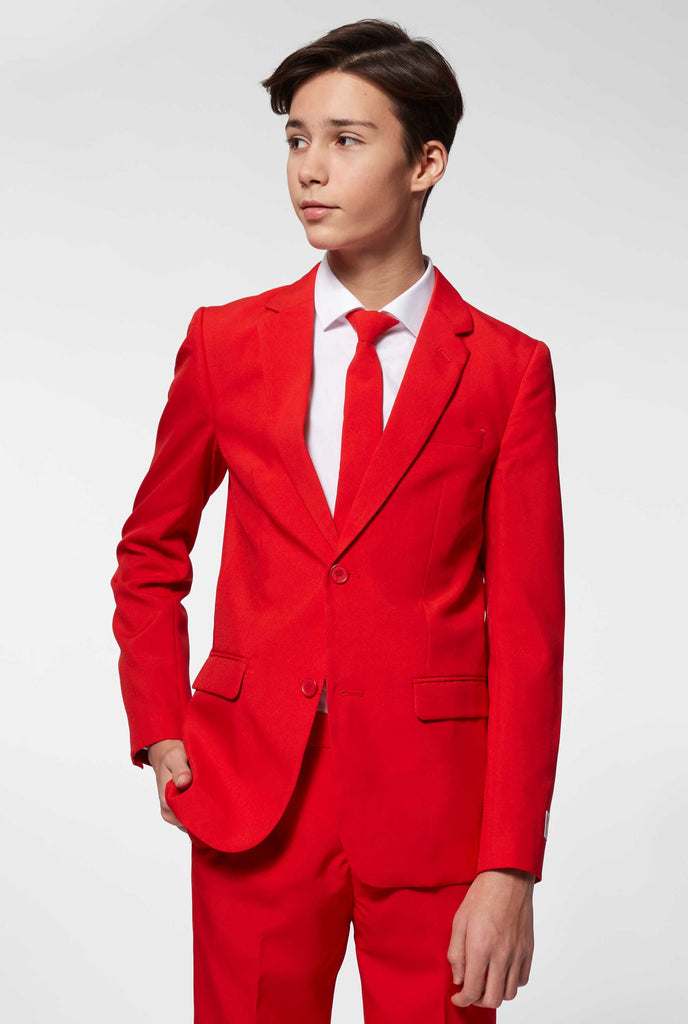 Teen wearing red formal suit