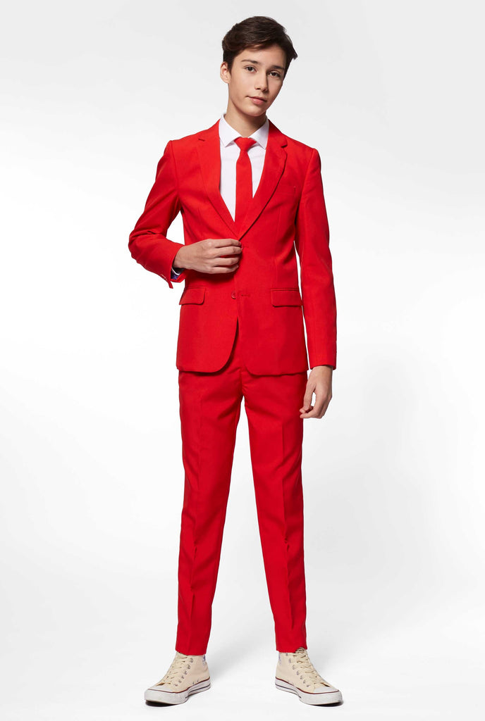 Teen wearing red formal suit