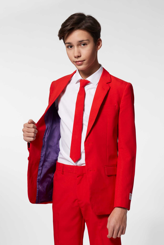 Teen wearing red formal suit