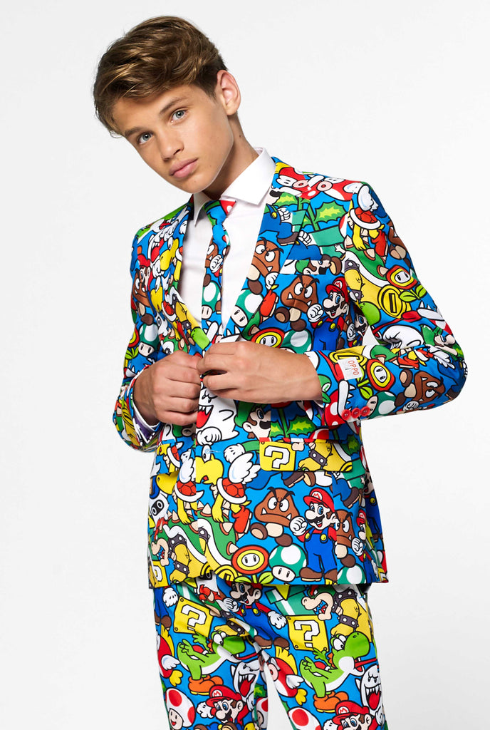 Teen wearing formal suit with colorful Super Mario print