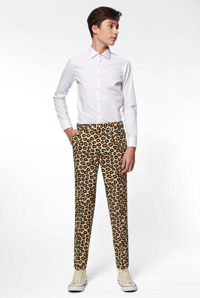 Teen wearing formal suit with panther print, pants view