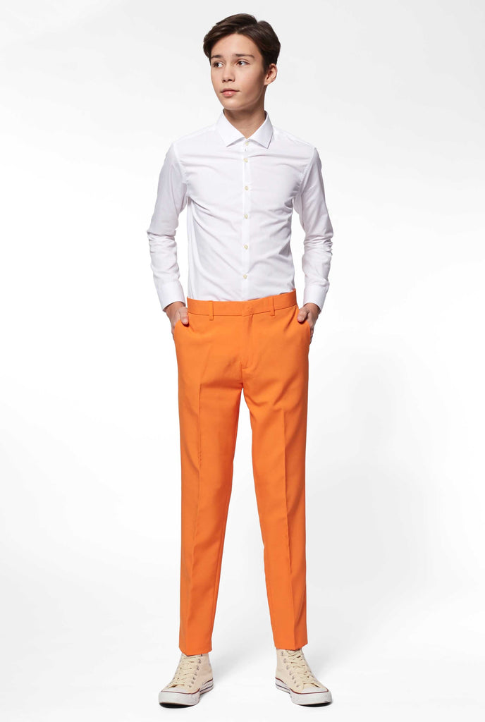 Teen wearing orange formal suit, view of pants