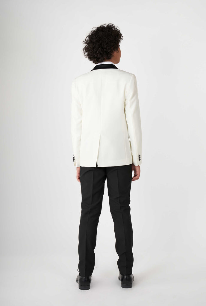 Teen wearing white and black tuxedo, view from the back