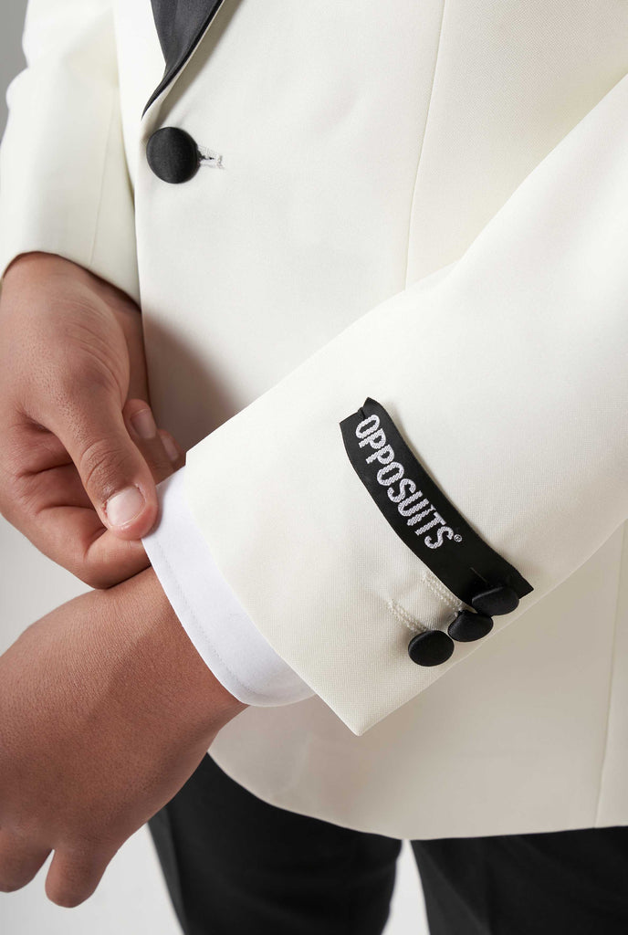 Teen wearing white and black tuxedo, close up