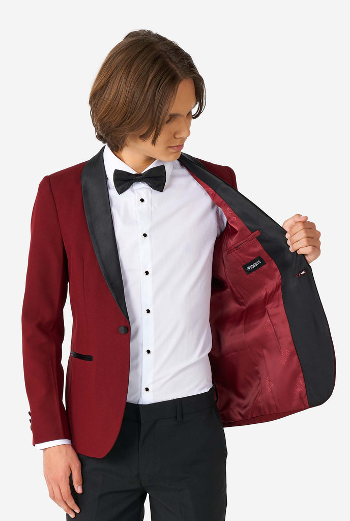 Teen wearing burgundy red and black tuxedo