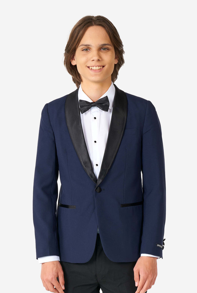 Teen wearing blue and black tuxedo