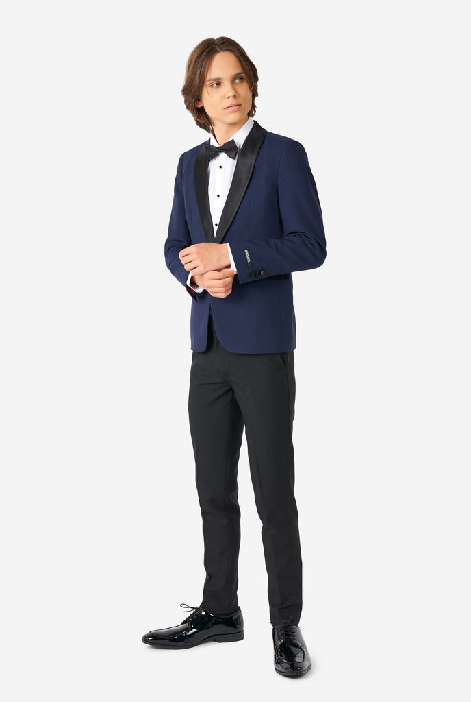 Teen wearing blue and black tuxedo