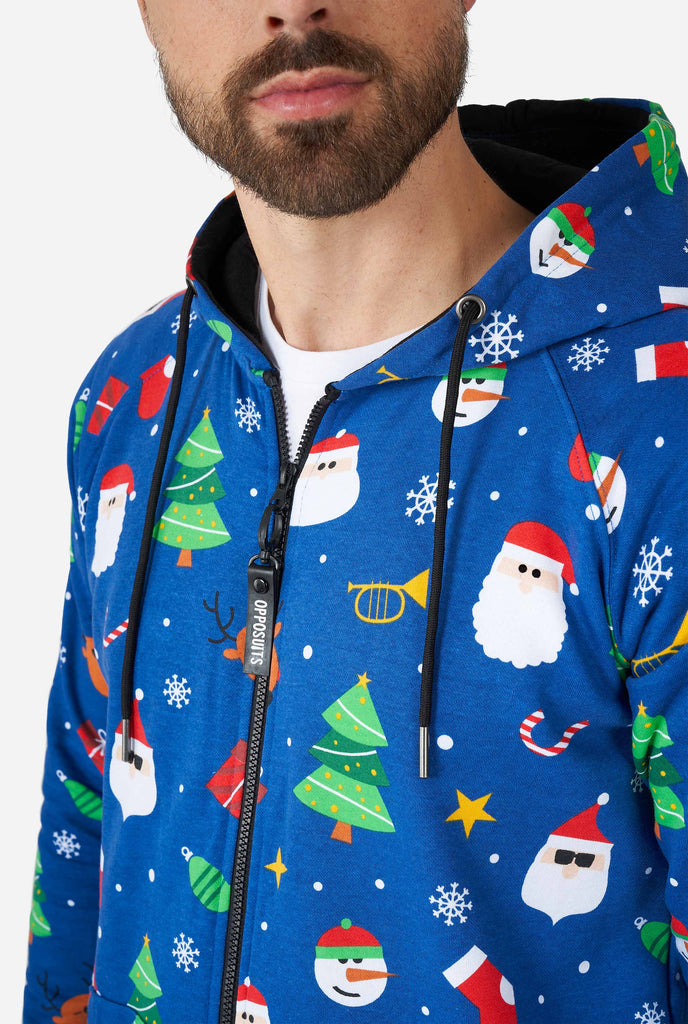 Man wearing blue Christmas onesie, chest close up