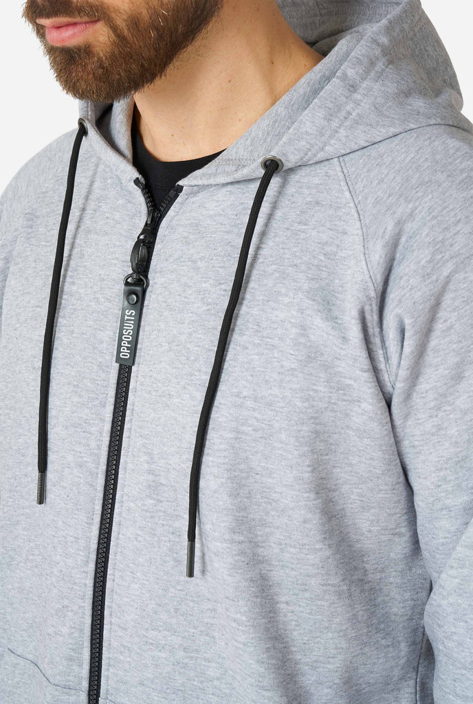 Man wearing grey onesie, chest close up