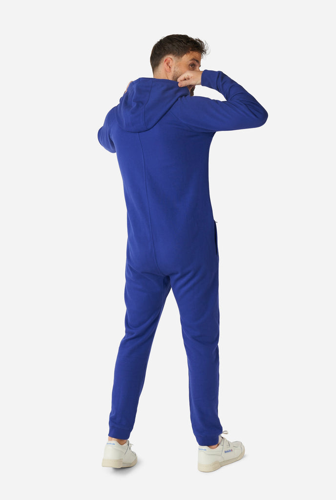 Man wearing Navy blue onesie, view from the back