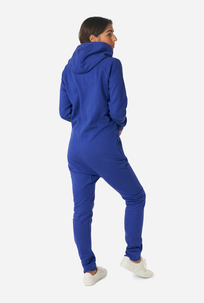 Woman wearing Navy blue onesie, view from the back