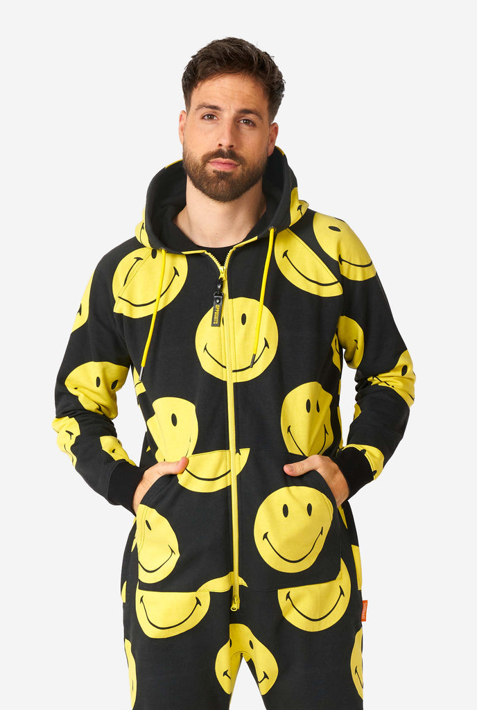 Man wearing black onesie with yellow smiley print