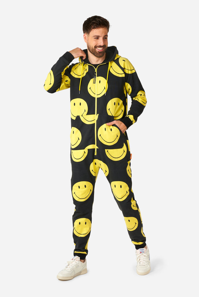 Man wearing black onesie with yellow smiley print