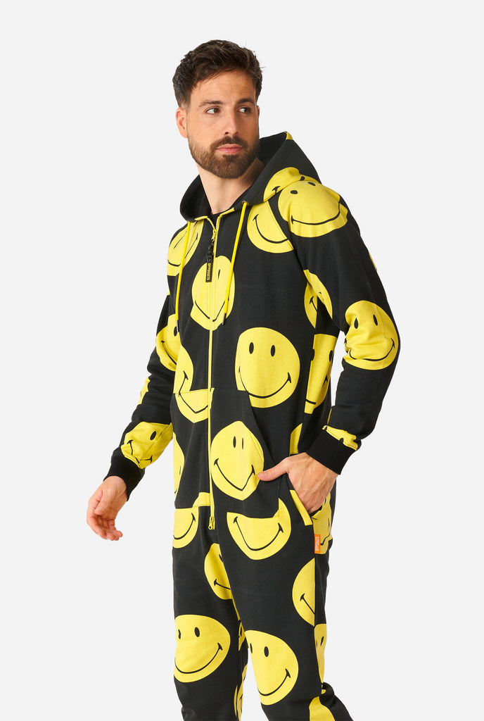 Man wearing black onesie with yellow smiley print