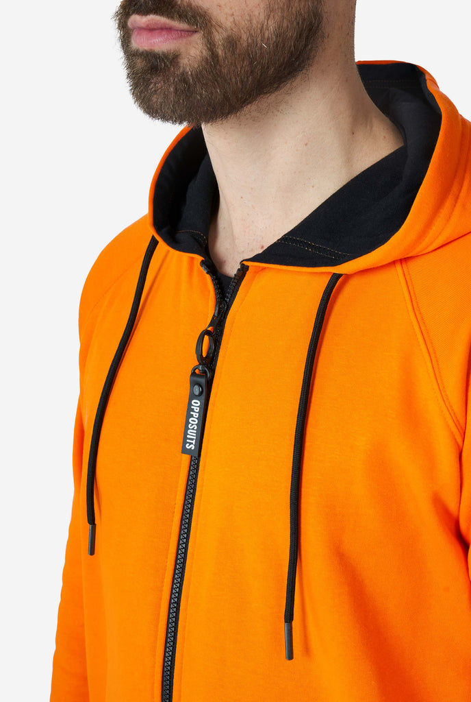 Man wearing orange onesie, close up