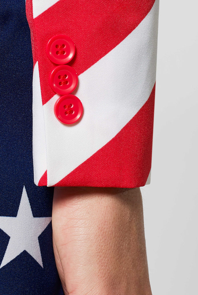 Women's patriotic American Flag suit worn by woman zoomed in at sleeve