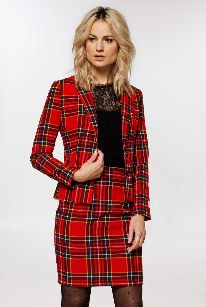 Woman wearing red tartan Christmas suit