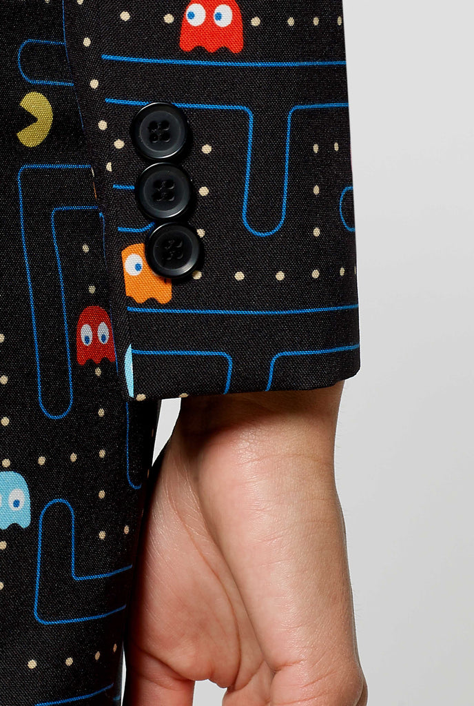 Woman wearing black dress suit with Pac-Man print, close up