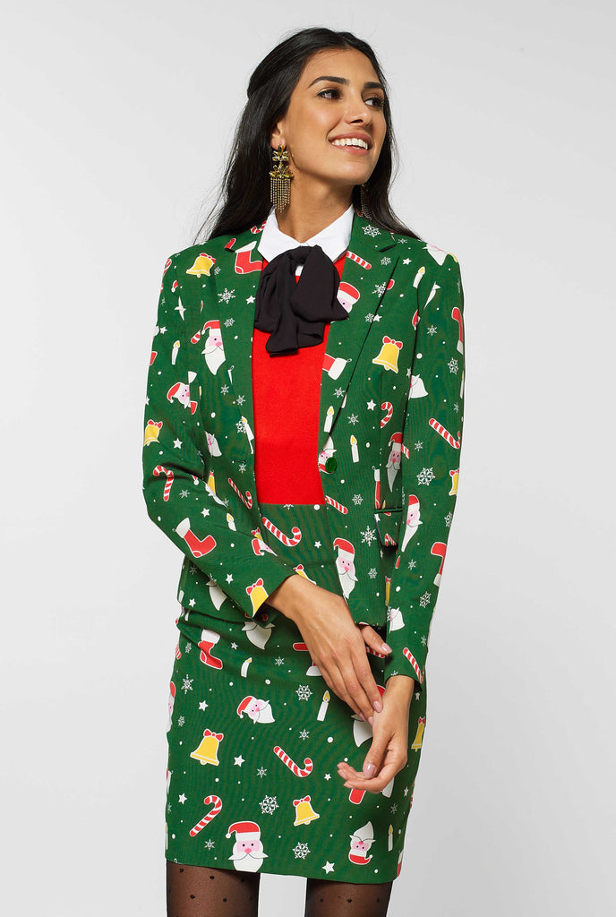 Woman wearing green suit with Christmas icons